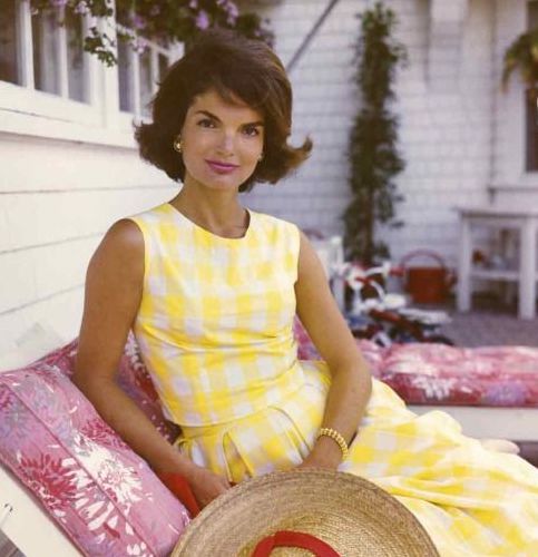 Jackie Kennedy outdoors wearing yellow sundress